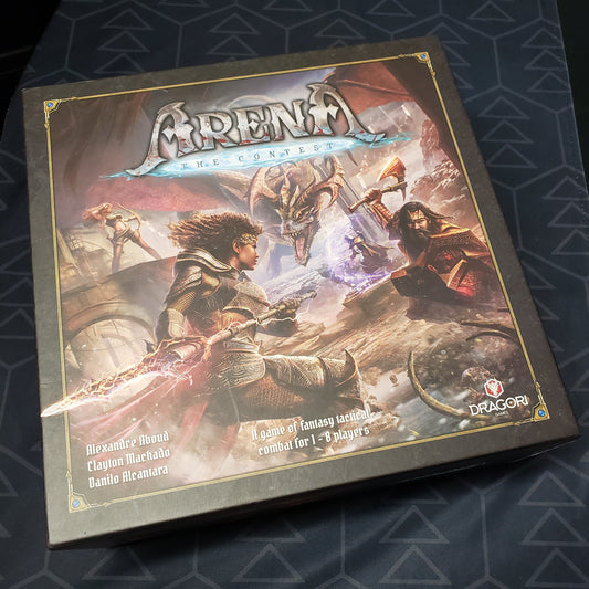 Image shows the front cover of the box of the board game Arena: The Contest