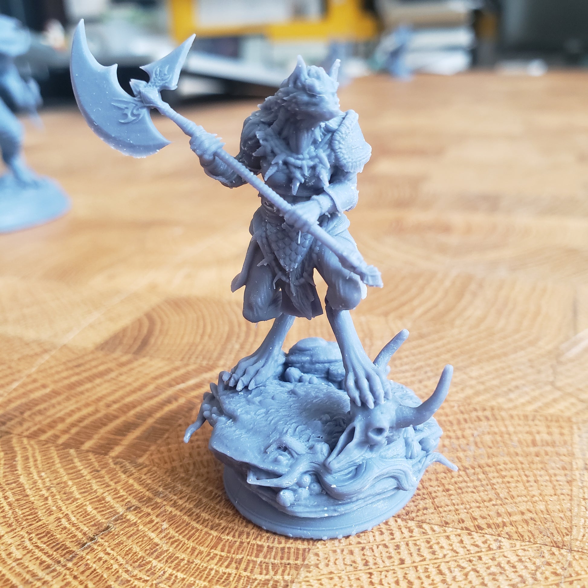 Image is a photo of a 3D printed werewolf barbarian gaming miniature printed in-house at All Systems Go