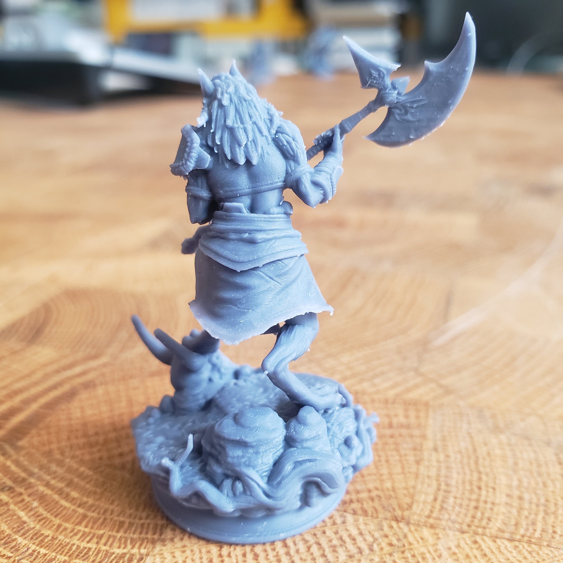 Image is a photo of a 3D printed werewolf barbarian gaming miniature printed in-house at All Systems Go