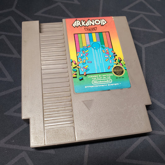 Image shows the front of the cartridge for the video game Arkanoid for the Nintendo Entertainment System