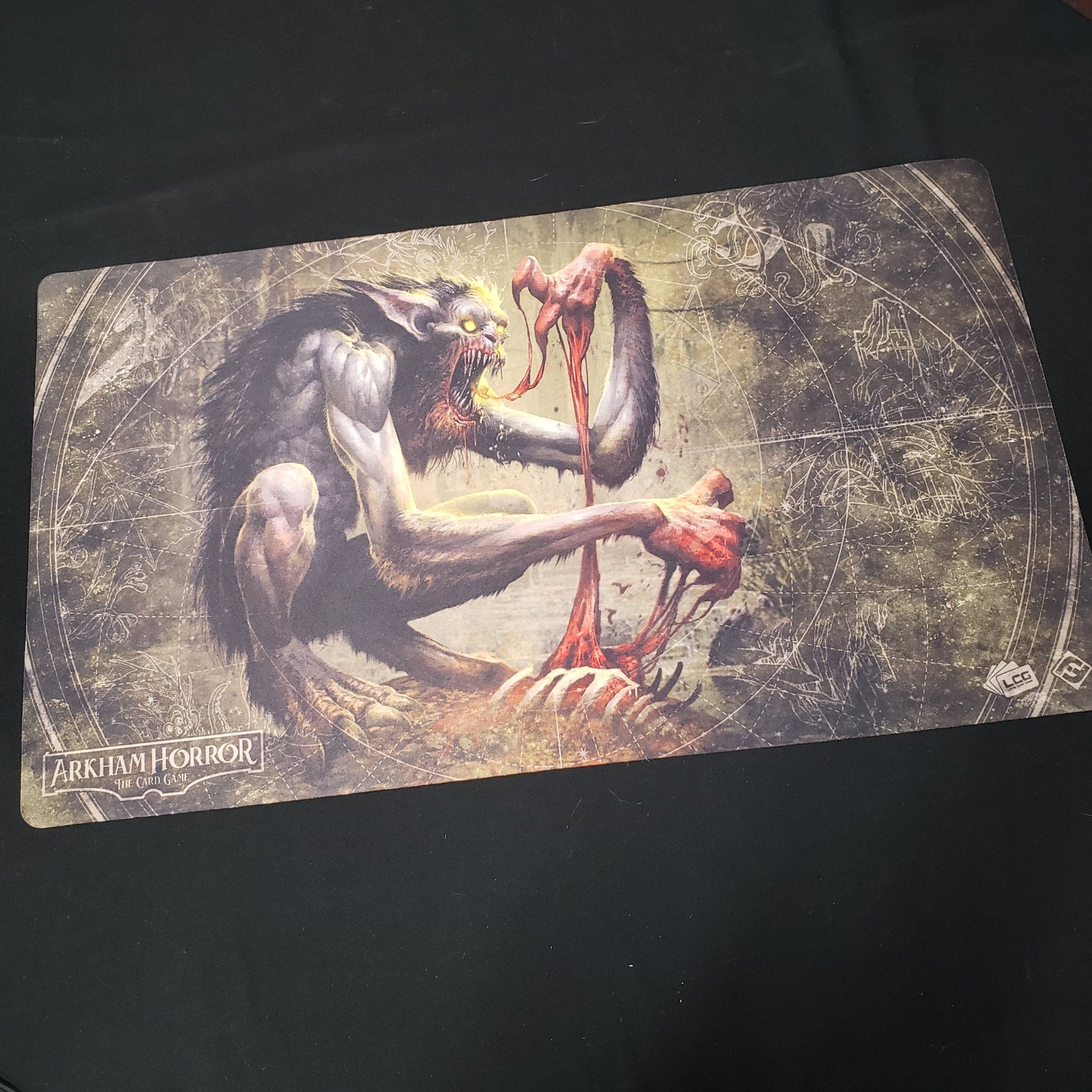 Image shows a playmat featuring the Bloodlust artwork for the Arkham Horror Card Game