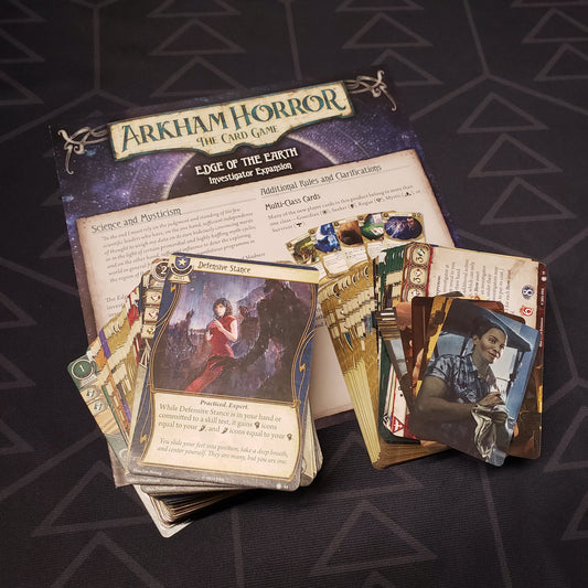 Image shows the cards & instructions for the Edge of the Earth Investigator expansion for the Arkham Horror Card Game