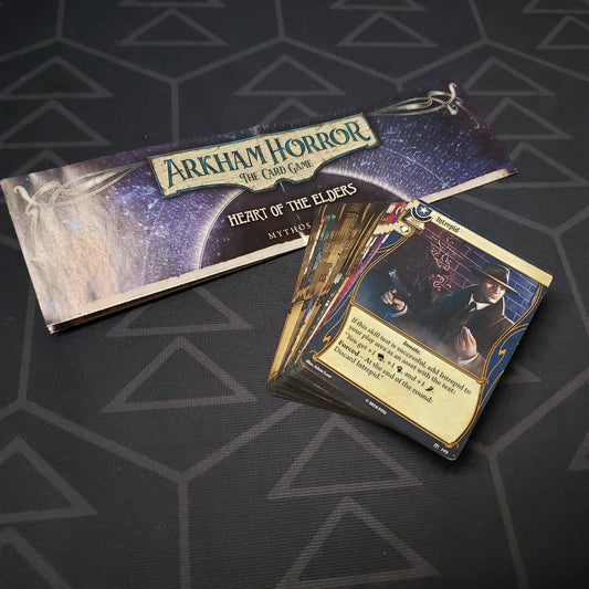 Image shows the instructions & cards for the Heart of the Elders Mythos Pack expansion for Arkham Horror: The Card Game