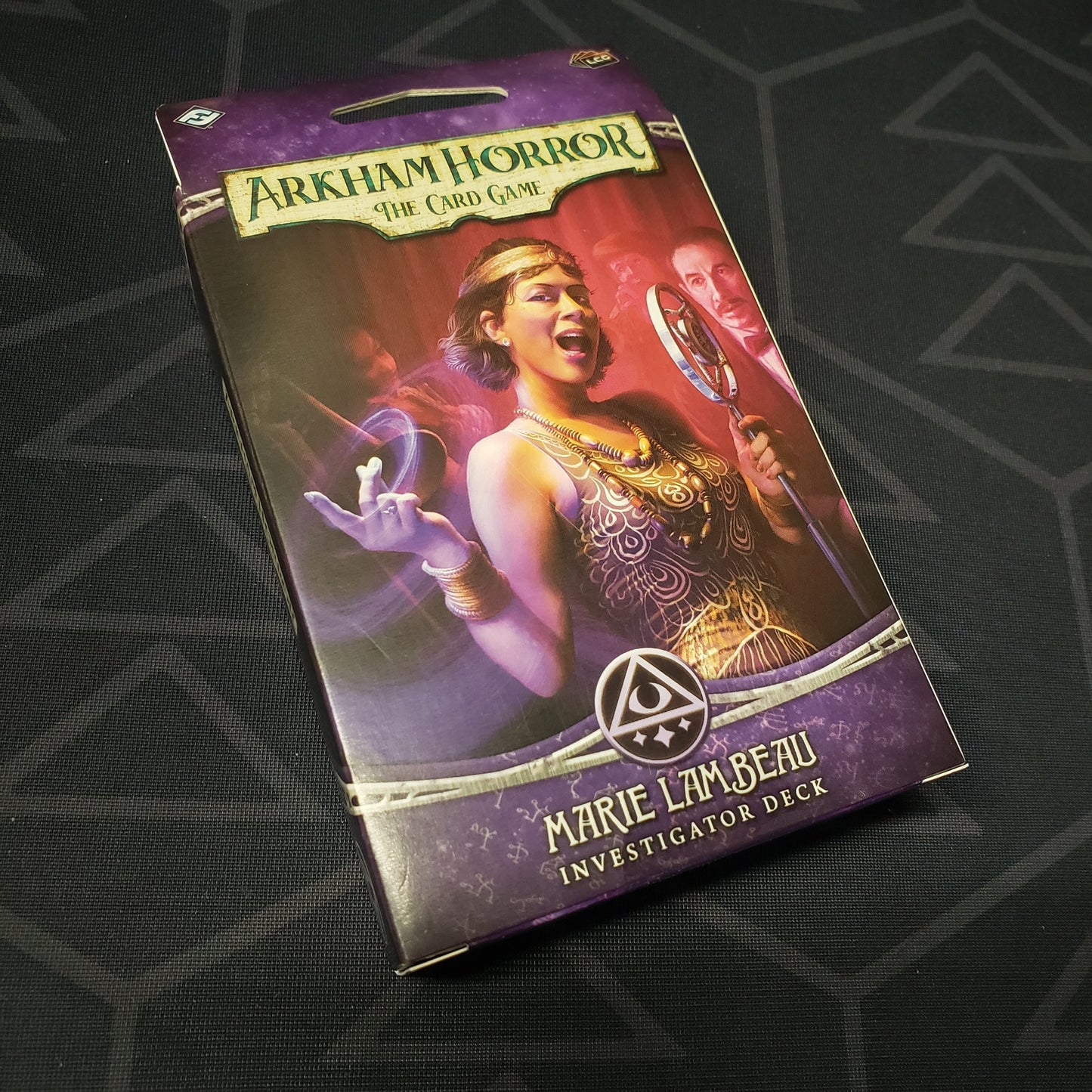 Image shows the front of the package of the Marie Lambeau Investigator Deck for the card game Arkham Horror