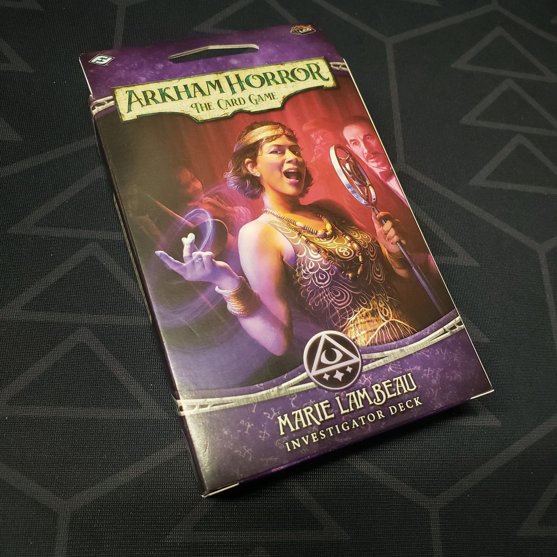 Image shows the front of the package of the Marie Lambeau Investigator Deck for the card game Arkham Horror