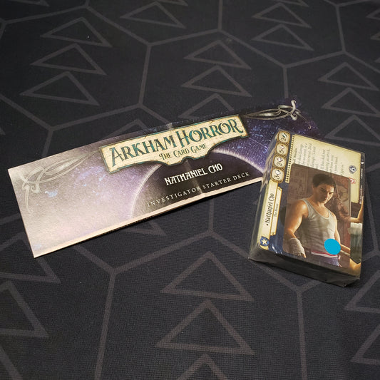 Image shows the shrinkwrapped cards & instructions for the Nathaniel Cho Investigator Starter Deck from the Arkham Horror Card Game