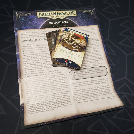 Image shows the cards & instruction sheet for the Secret Name Mythos pack for the card game Arkham Horror