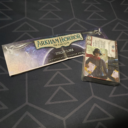Image shows the shrinkwrapped cards & instructions for the Stella Clark Investigator Starter Deck from the Arkham Horror Card Game