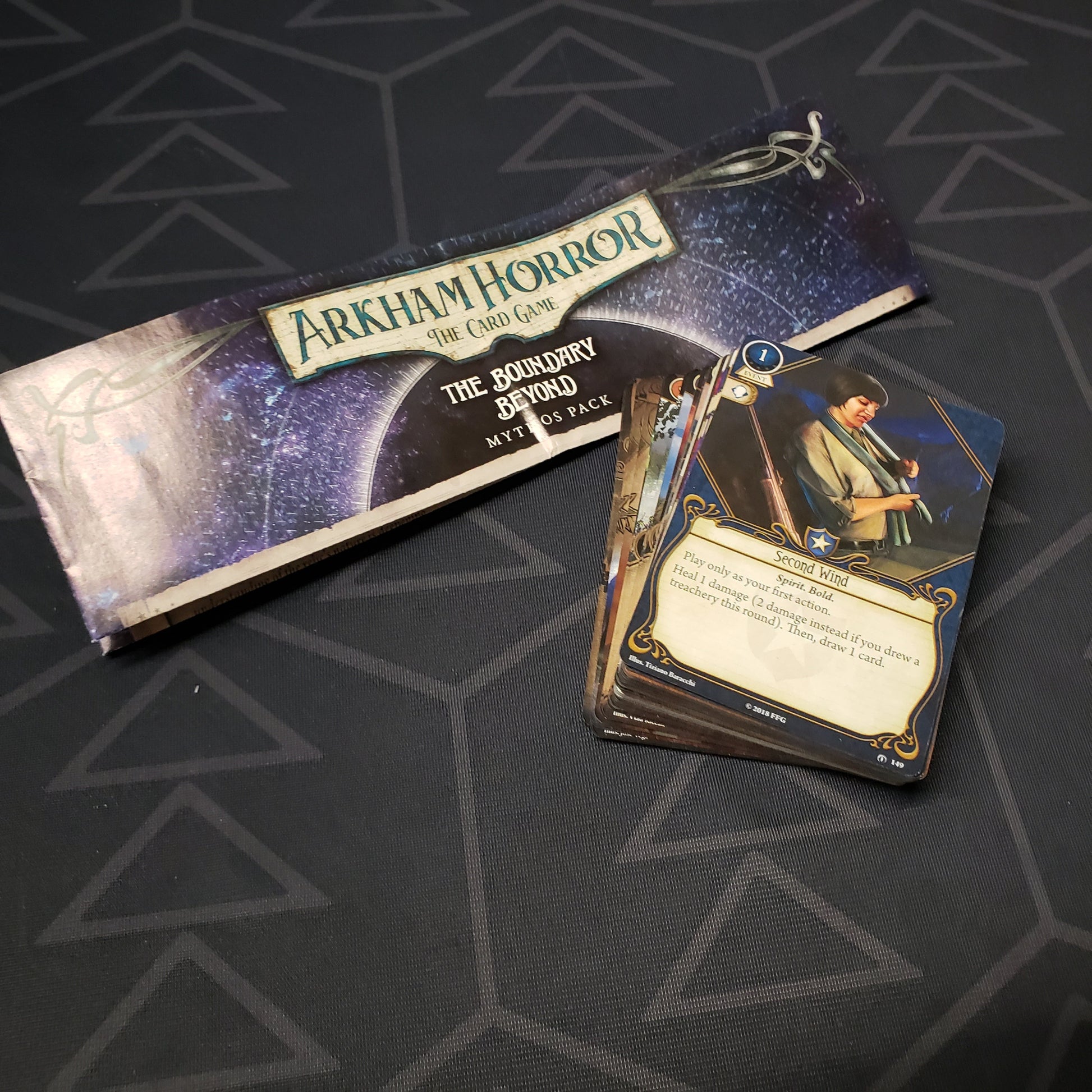 Image shows the instructions & cards for the Boundary Beyond Mythos Pack expansion for Arkham Horror: The Card Game