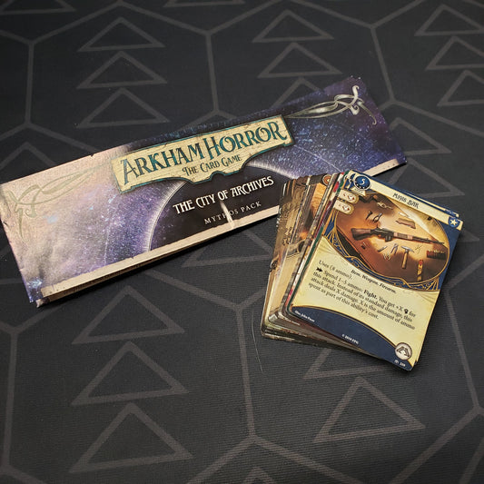 Image shows the instructions & cards for the City of Archives Mythos Pack expansion for Arkham Horror: The Card Game