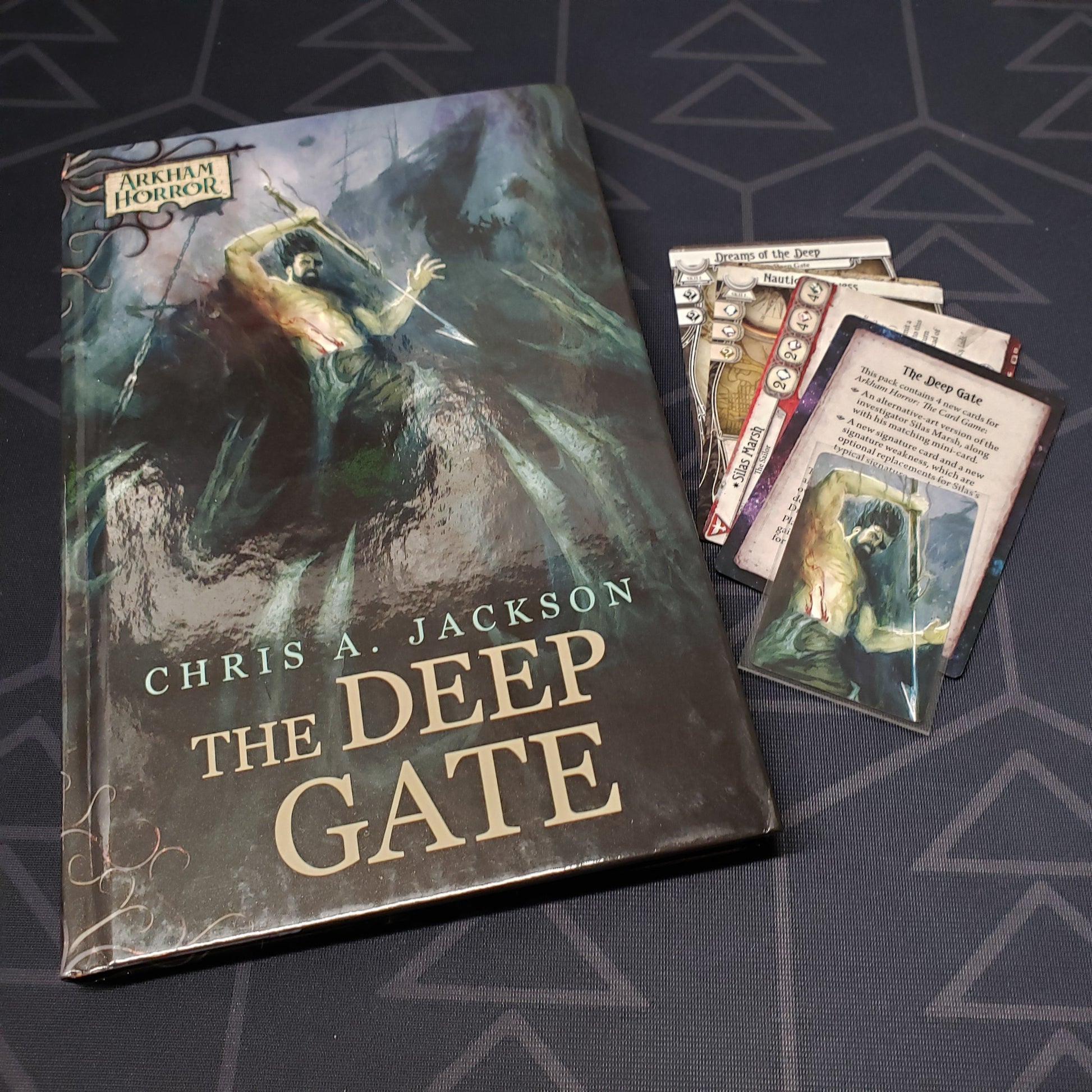 Image shows the front cover of the Deep Gate novella & character promo cards for Arkham Horror: The Card Game