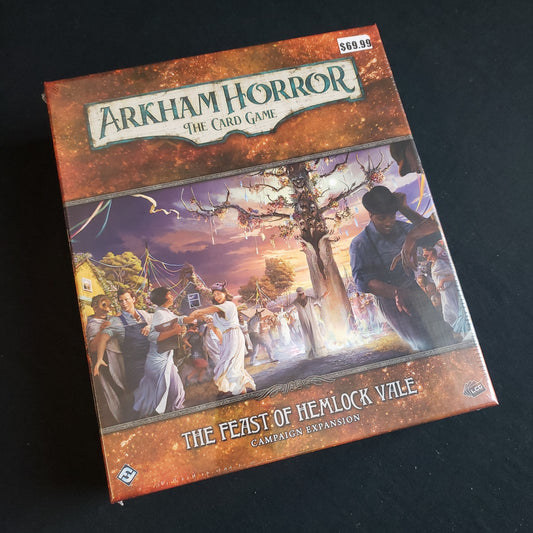 Image shows the front of the box for the Feast of Hemlock Vale Campaign Expansion for the Arkham Horror card game