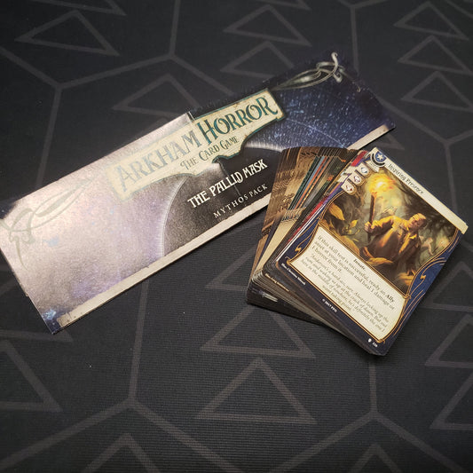 Image shows the instructions & cards for the Pallid Mask Mythos Pack expansion for Arkham Horror: The Card Game