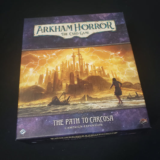 Image shows the front cover of the box for the Path to Carcosa Campaign expansion from the Arkham Horror Card Game