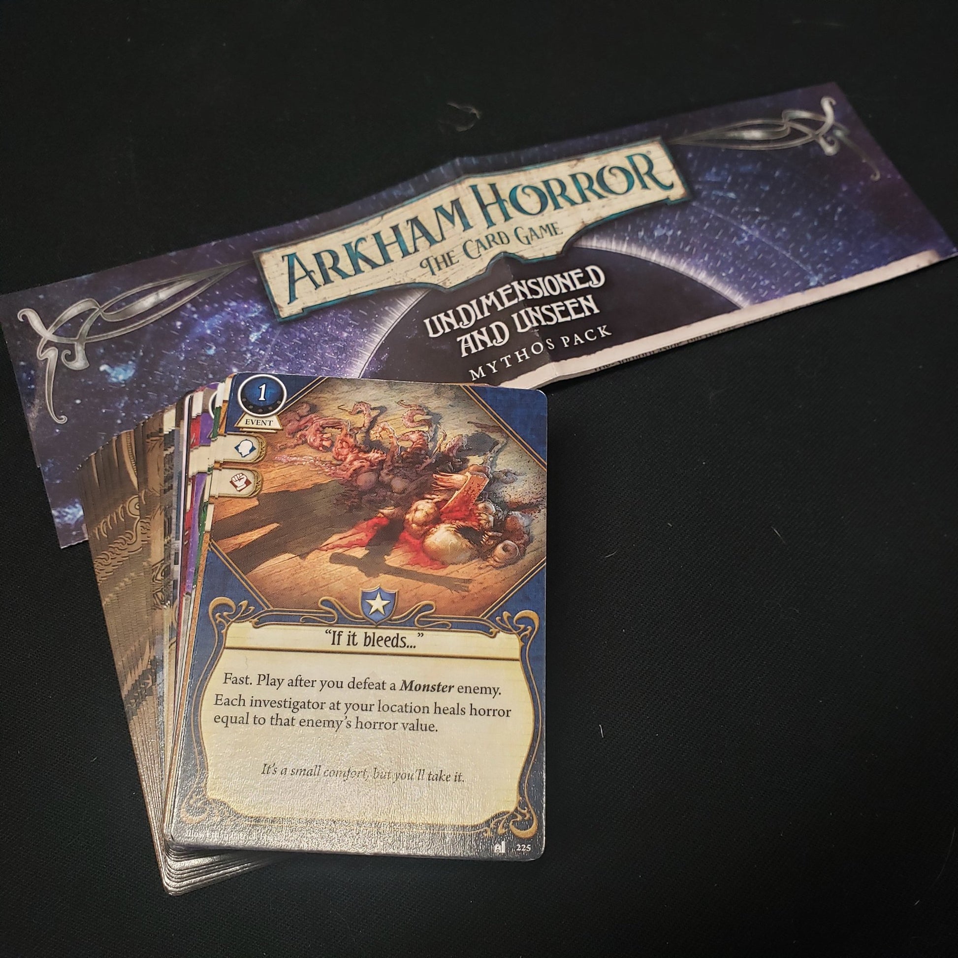 Image shows thecards and instructions for the Undimensioned and Unseen Mythos Pack for the Arkham Horror card game