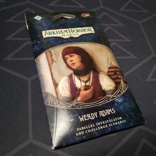 Image shows the front of the packaging of the Wendy Adams Parallel Investigator & Challenged Scenario expansion for Arkham Horror: The Card Game