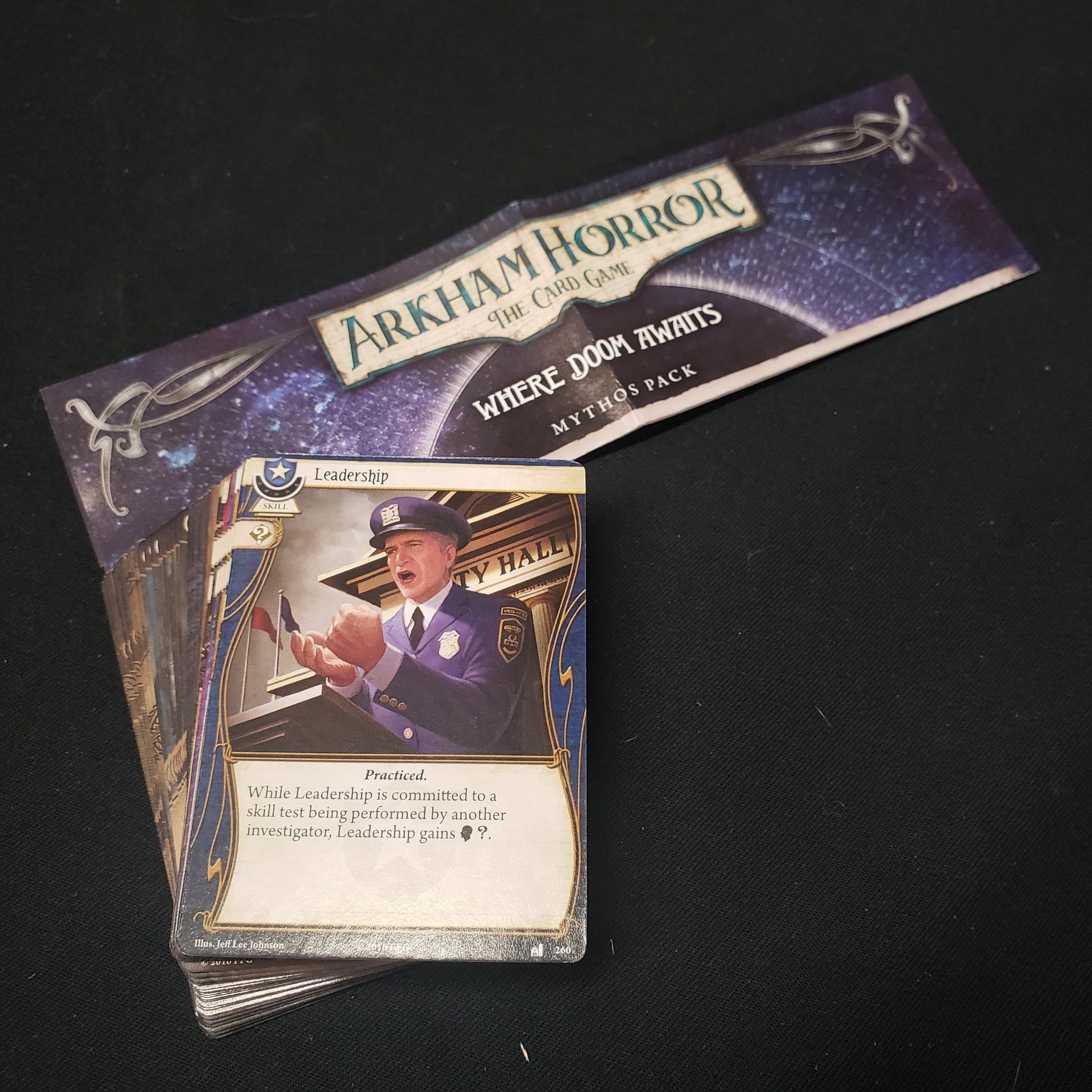 Image shows the cards & instructions for the Where Doom Awairs Mythos Pack expansion for Arkham Horror: The Card Game