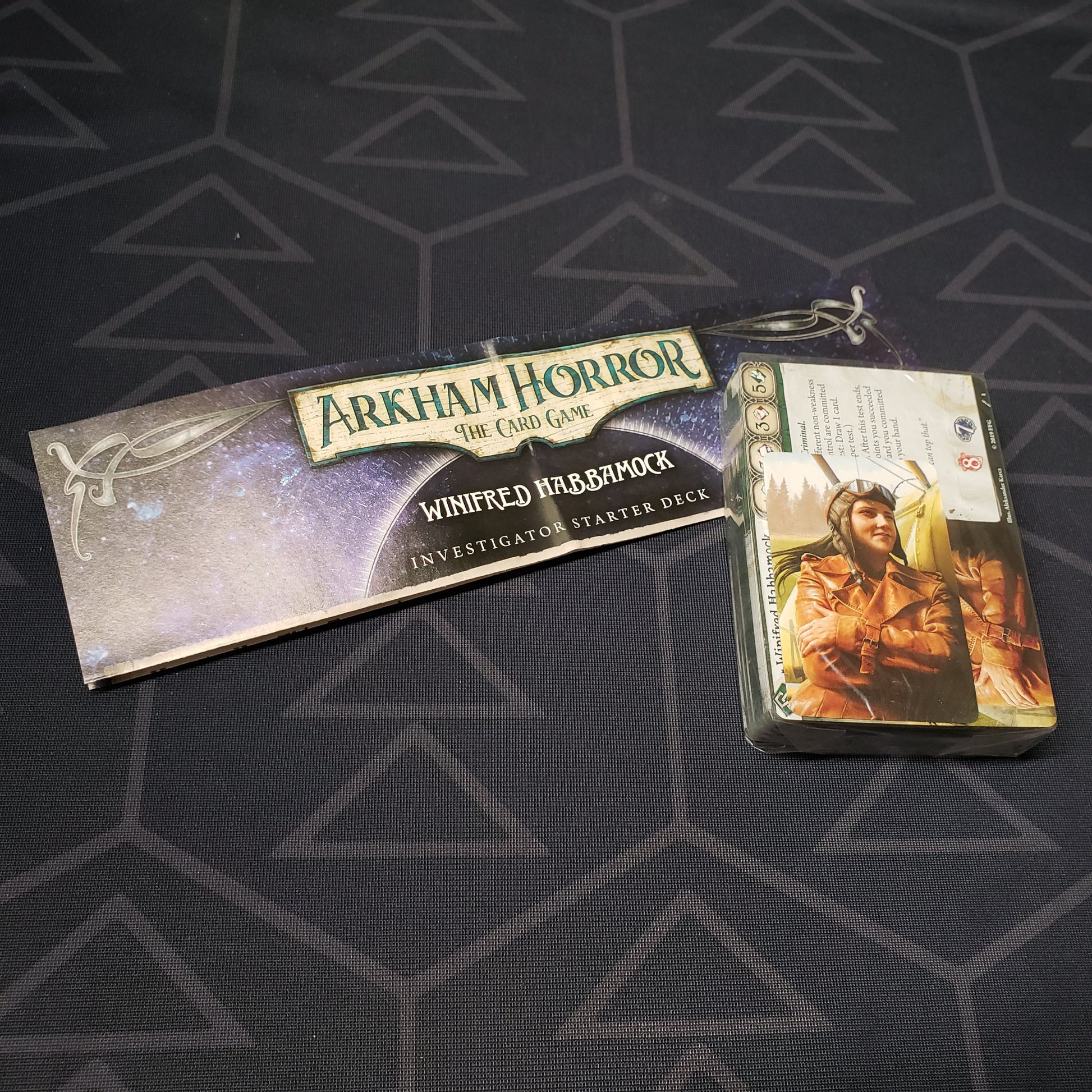 Image shows the shrinkwrapped cards & instructions for the Winifred Habbamock Investigator Starter Deck from the Arkham Horror Card Game