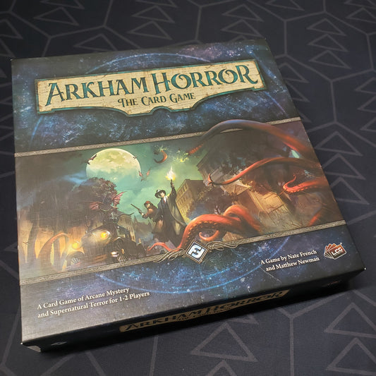Image shows the front cover of the box of Arkham Horror: The Card Game