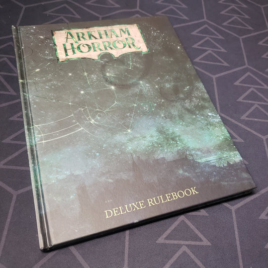 Image shows the front cover of the Arkham Horror: Third Edition Deluxe Rulebook gaming book