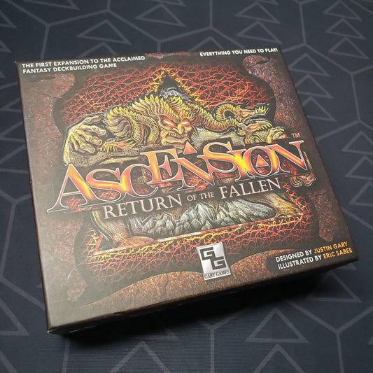 Image shows the front cover of the box of the Return of the Fallen expansion for the card game Ascension