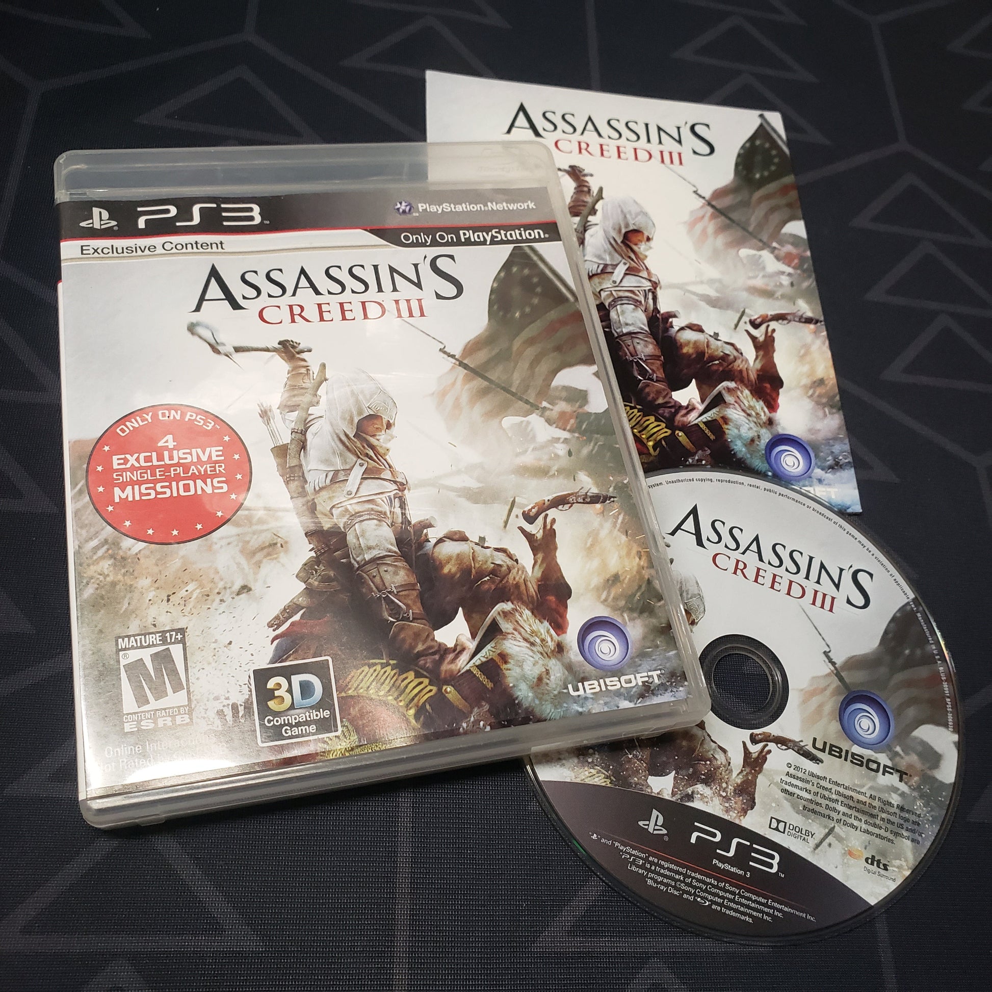 Image shows the case, manual and disc for the video game Assassin's Creed III for Playstation 3