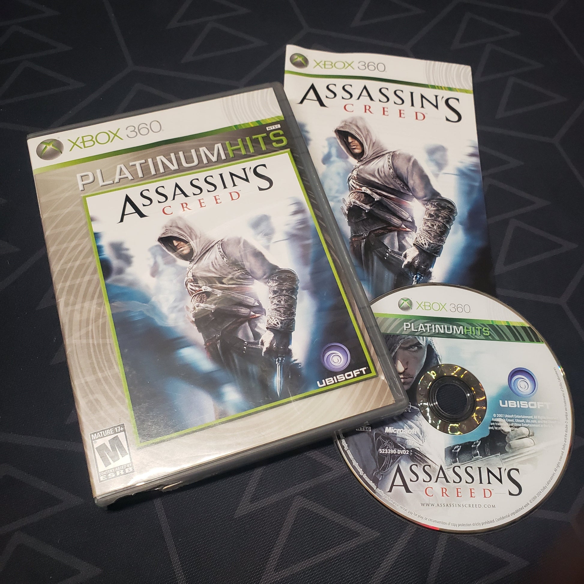 Image shows the case, manual and disc for the video game Assassin's Creed for Xbox 360