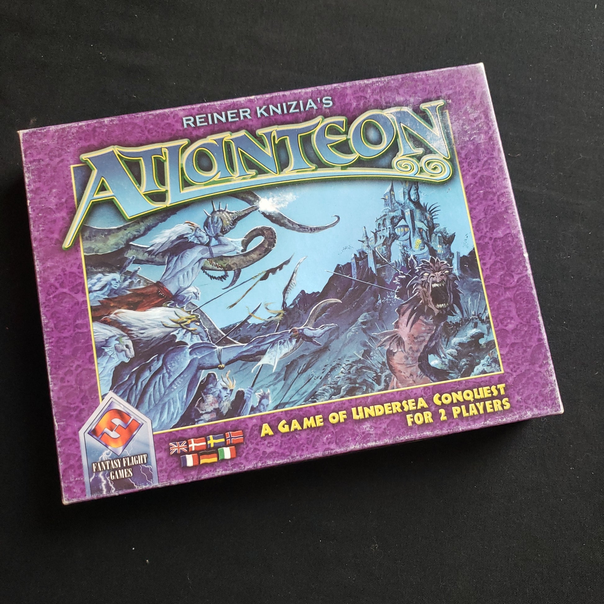 Image shows the front cover of the box of the Atlanteon board game