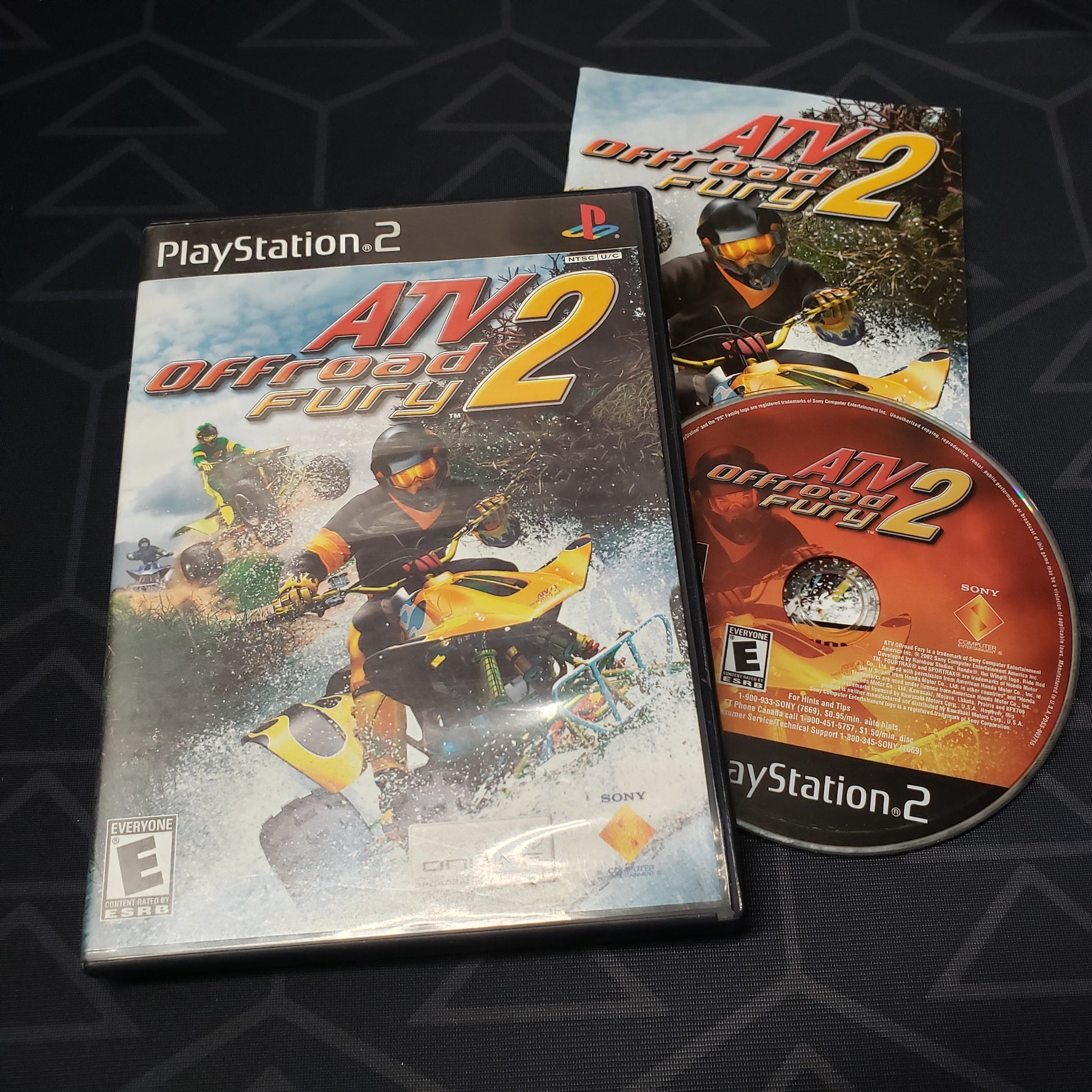 Image shows the case, manual and disc for the video game ATV Offroad Fury 2 for Playstation 2