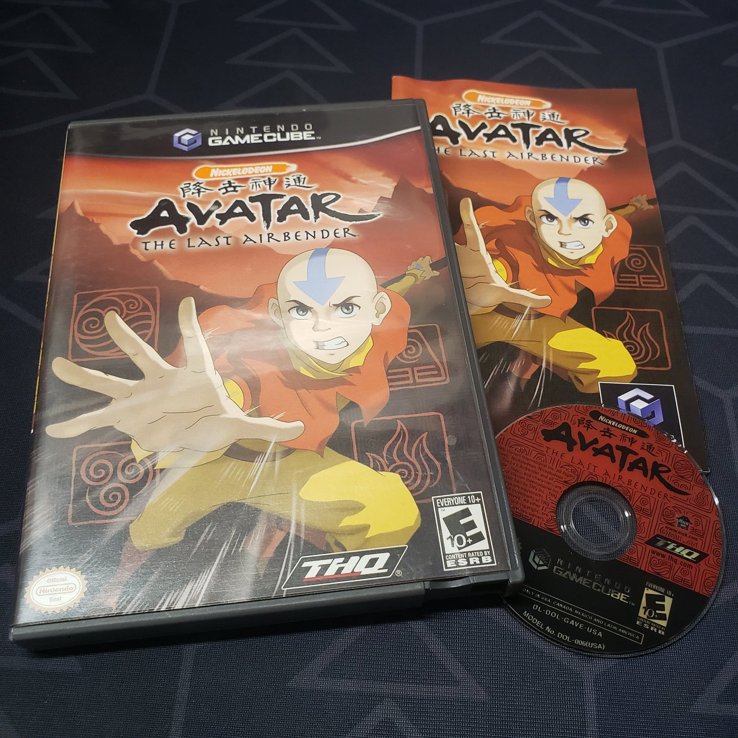 Image shows the case, manual and disc for the video game Avatar: The Last Airbender for Nintendo GameCube
