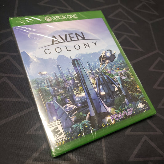 Image shows the front of the case for the video game Aven Colony for Xbox One