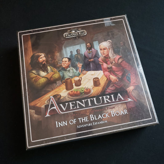 Image shows the front cover of the box of the Inn of the Black Boar expansion for the Aventuria: Adventure Card Game