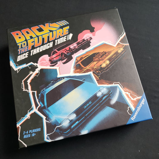 Image shows the front cover of the box of the Back to the Future: Dice Through Time board game