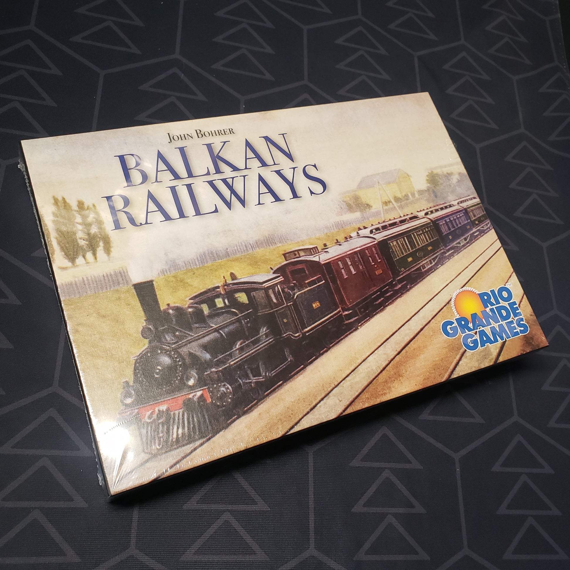 Image shows the front cover of the box for the Balkan Railways board game