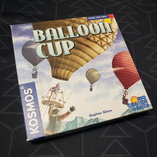Image shows the front cover of the box for the Balloon Cup card game