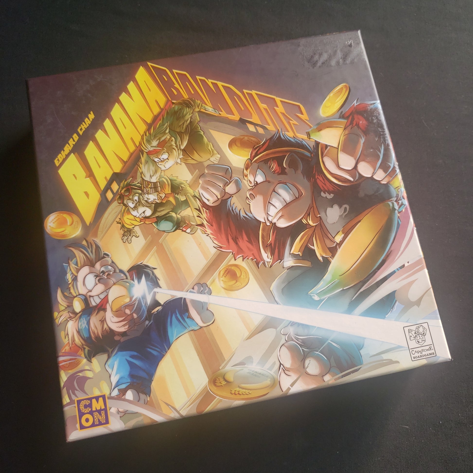 Image shows the front cover of the box of the Banana Bandits board game