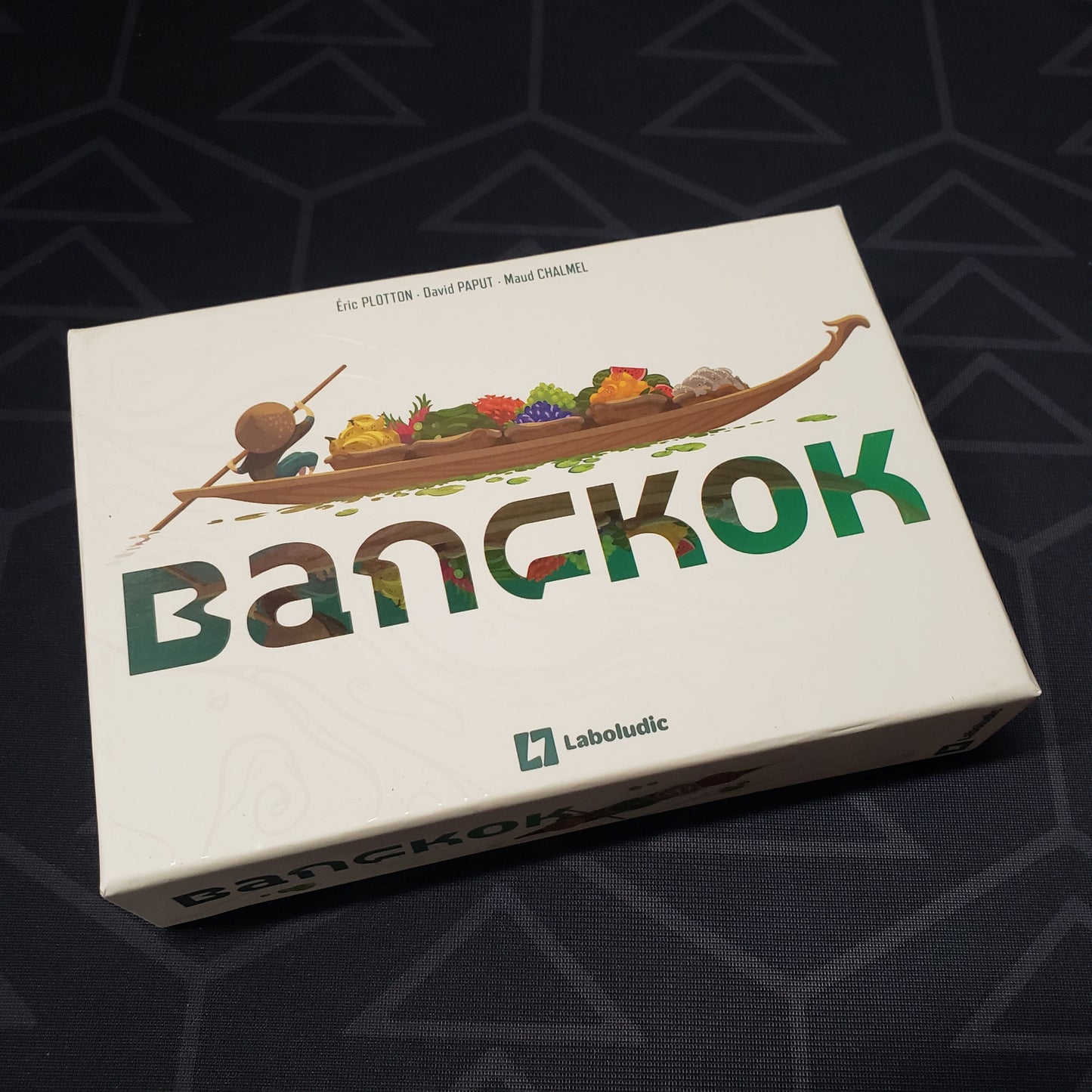 Image shows the front cover of the box of the Bangkok card game