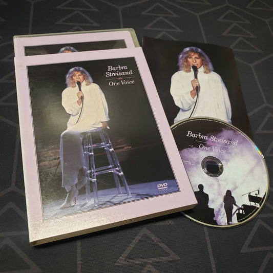 Image shows the case, sleeve, insert & disc for the live concert film Barbra Streisand: One Voice on DVD