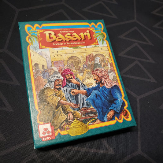 Image shows the front cover of the box for the Basari: Das Kartenspiel card game
