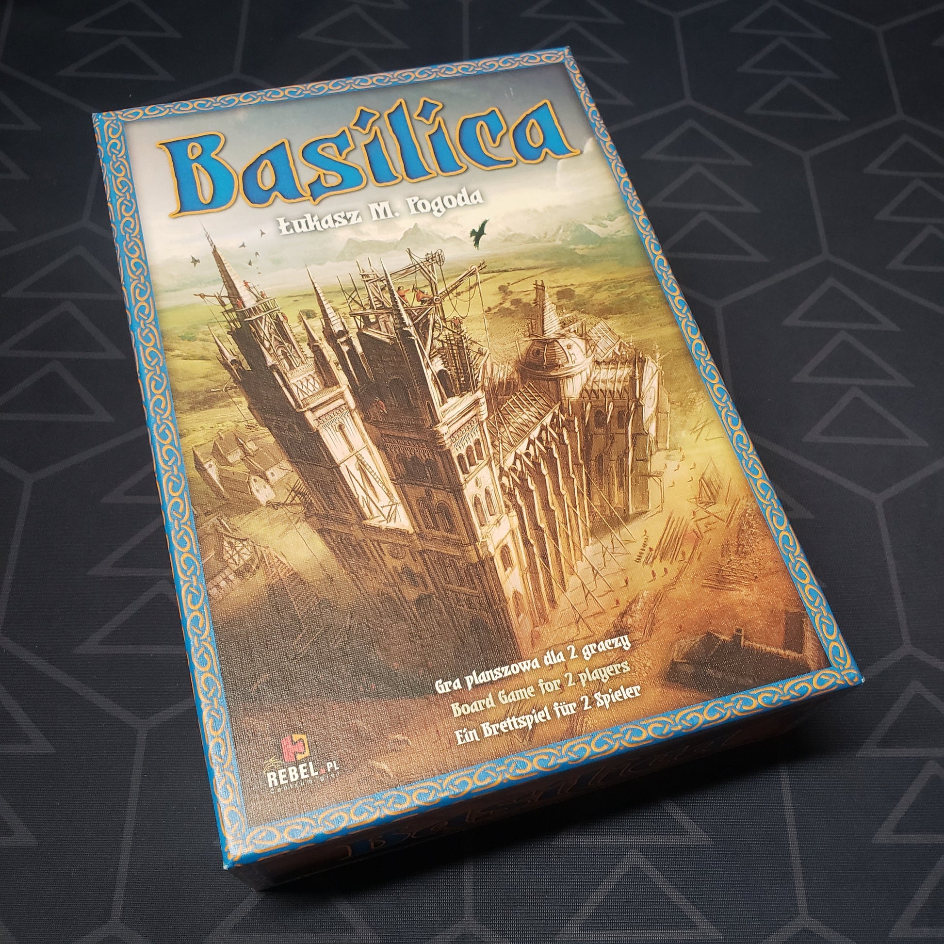 Image shows the front cover of the box for the Basilica (2010 Edition) board game