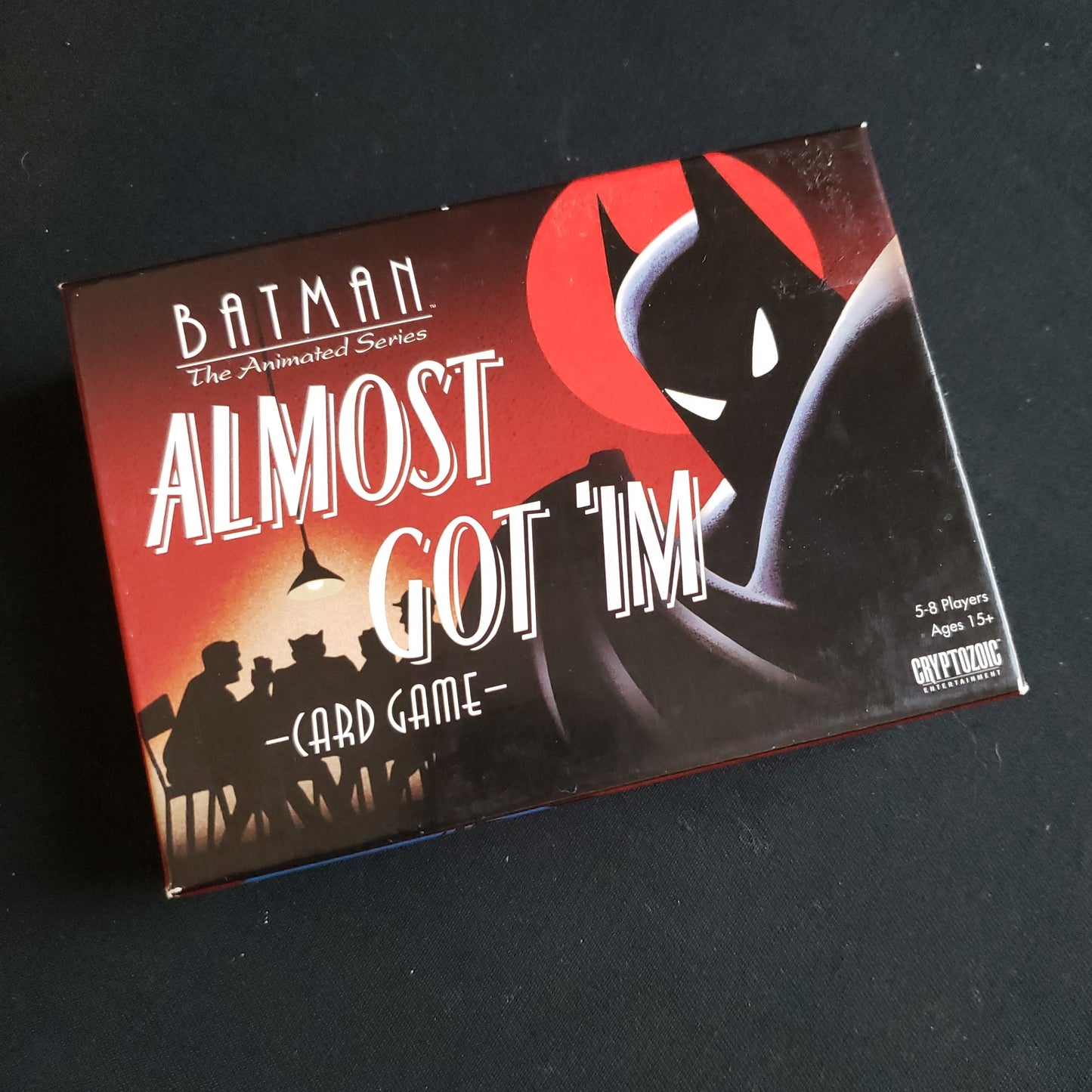 Image shows the front cover of the box of the Batman: Almost Got 'Im card game