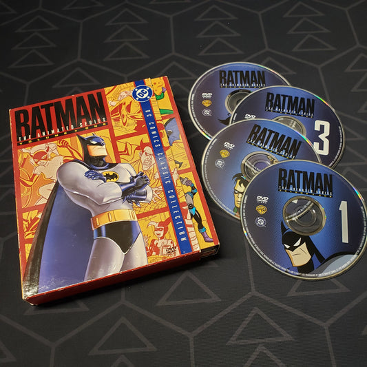 Image shows the case, outer box & four discs for the Volu9me 1 box set of Batman: The Animated Series on DVD