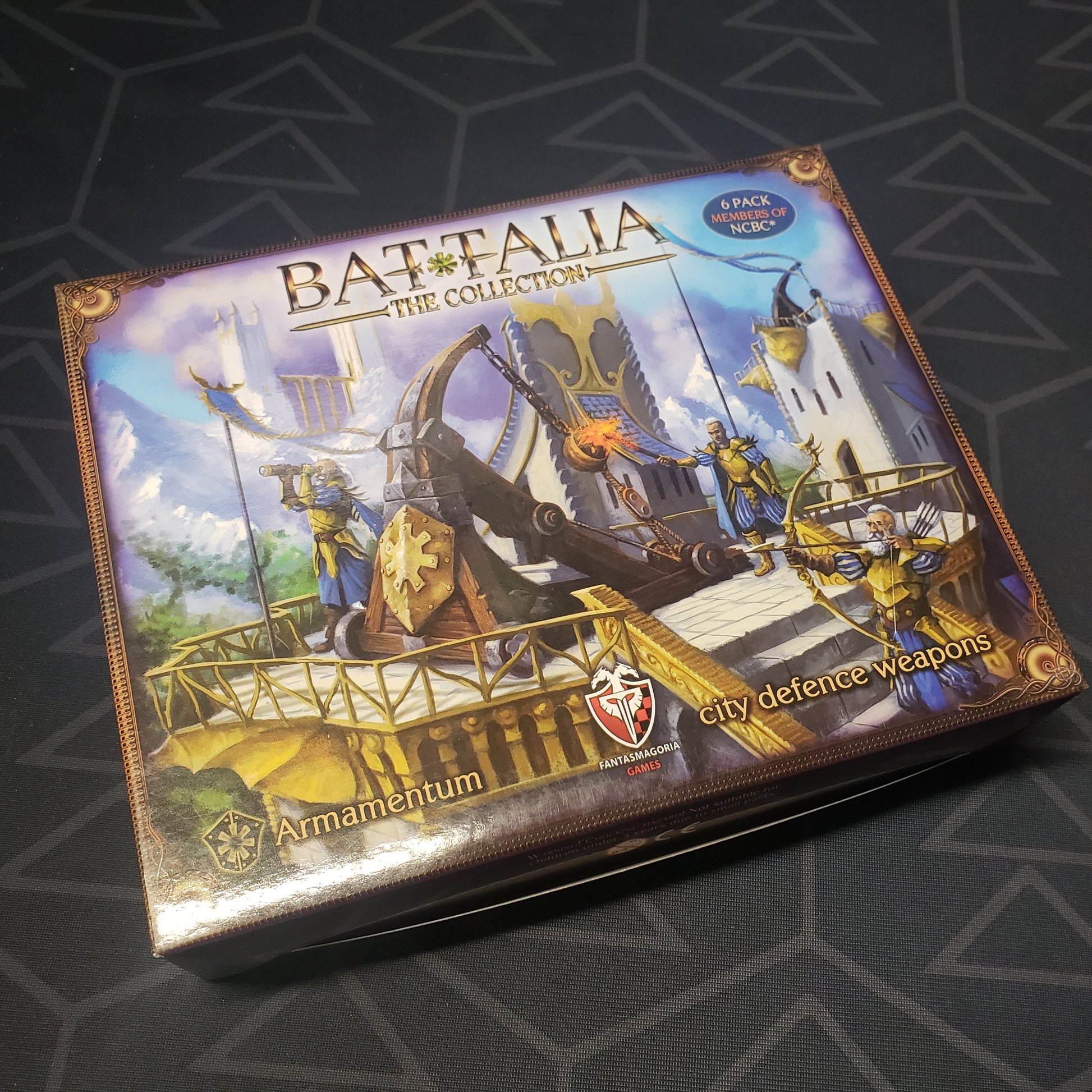 Image shows the front cover of the box of the Armamentum expansion for the board game Battalia