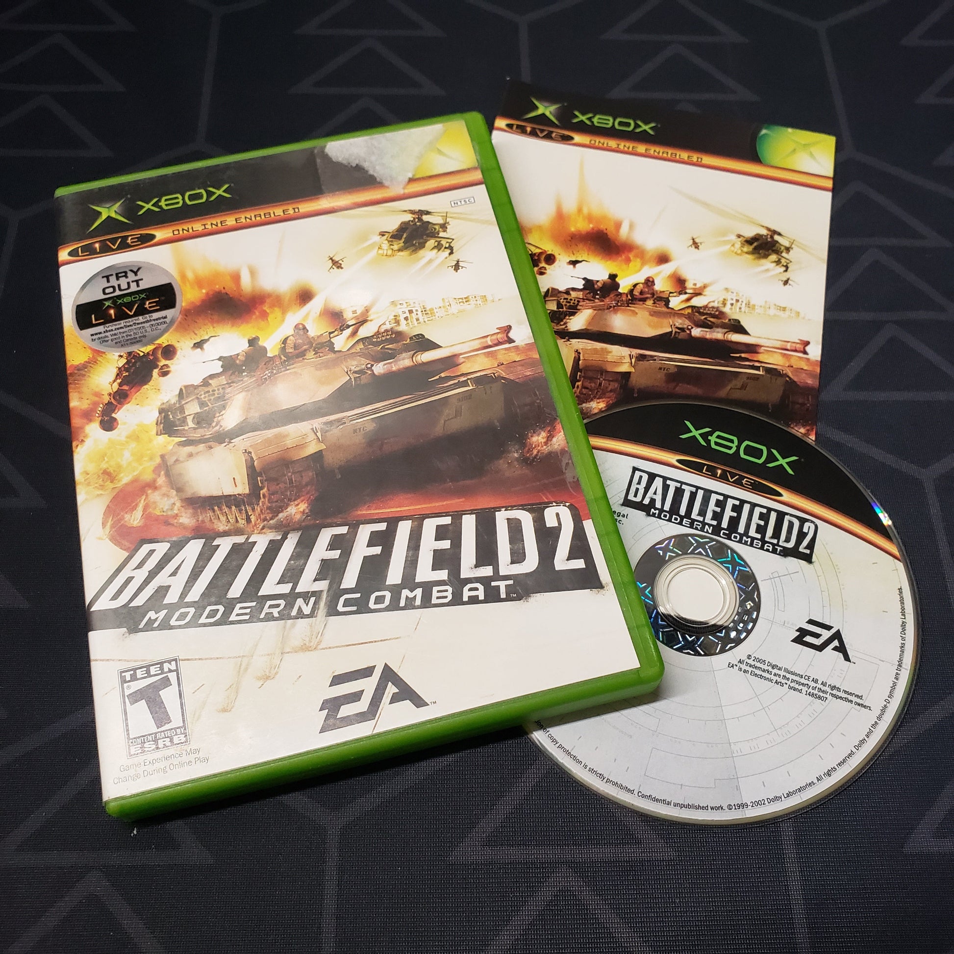 Image shows the case, manual and disc for the video game Battlefield 2: Modern Combat for the original Xbox
