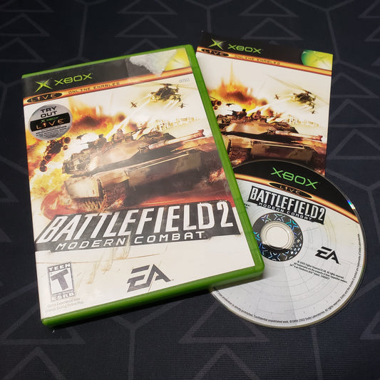 Image shows the case, manual and disc for the video game Battlefield 2: Modern Combat for the original Xbox