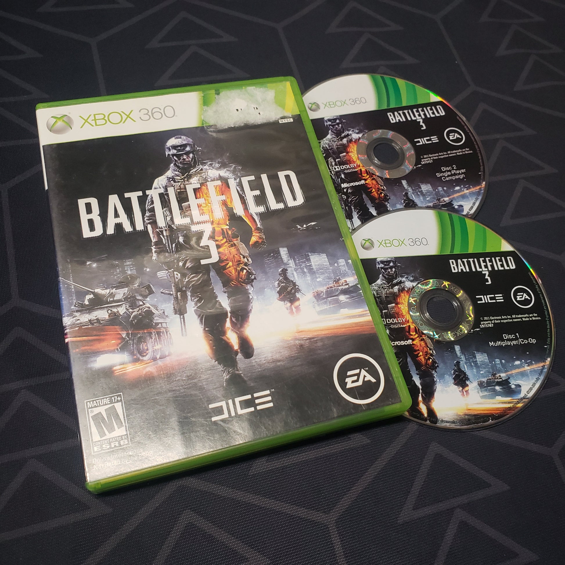 Image shows the case and two discs for the video game Battlefield 3 for Xbox 360
