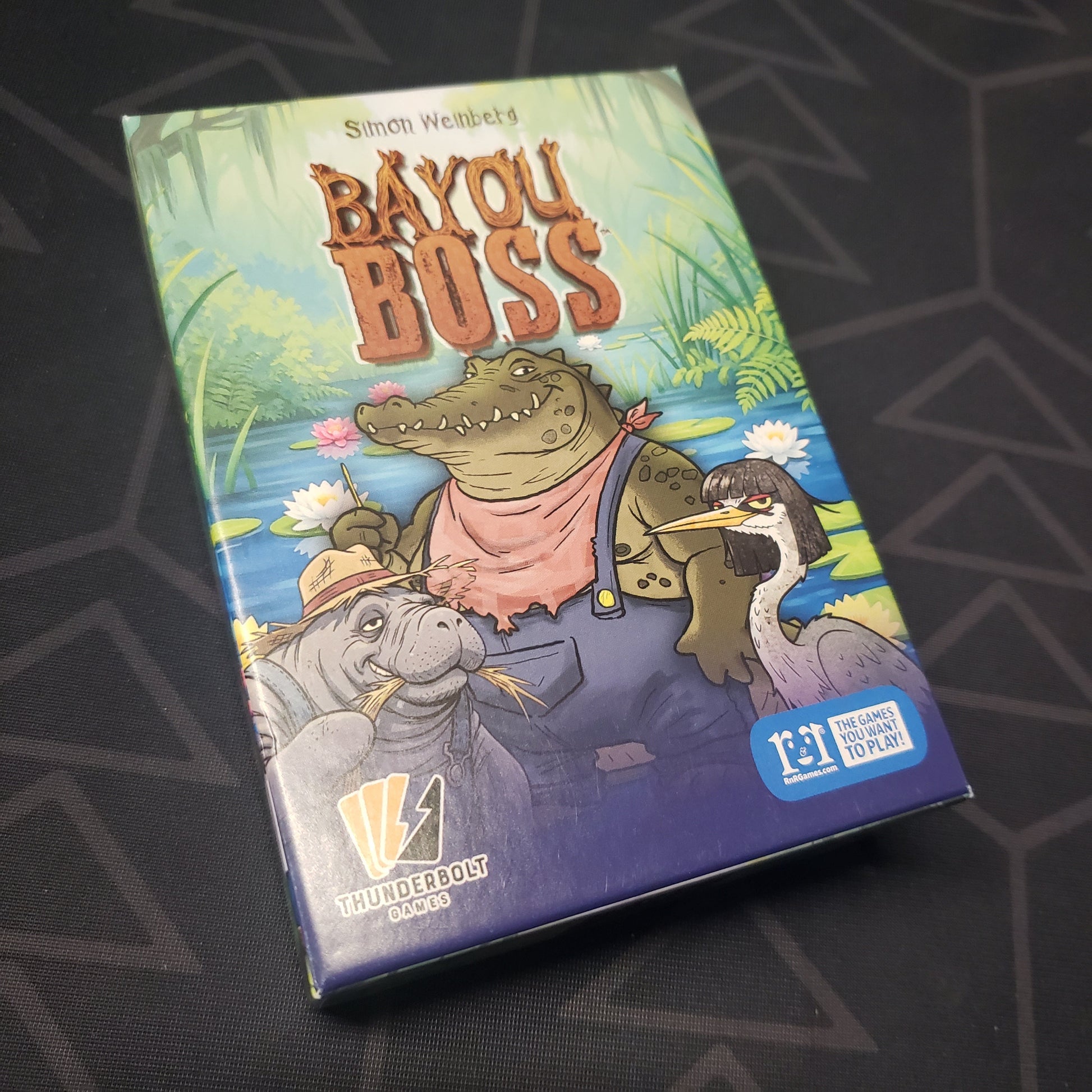 Image shows the front cover of the box for the Bayou Boss card game