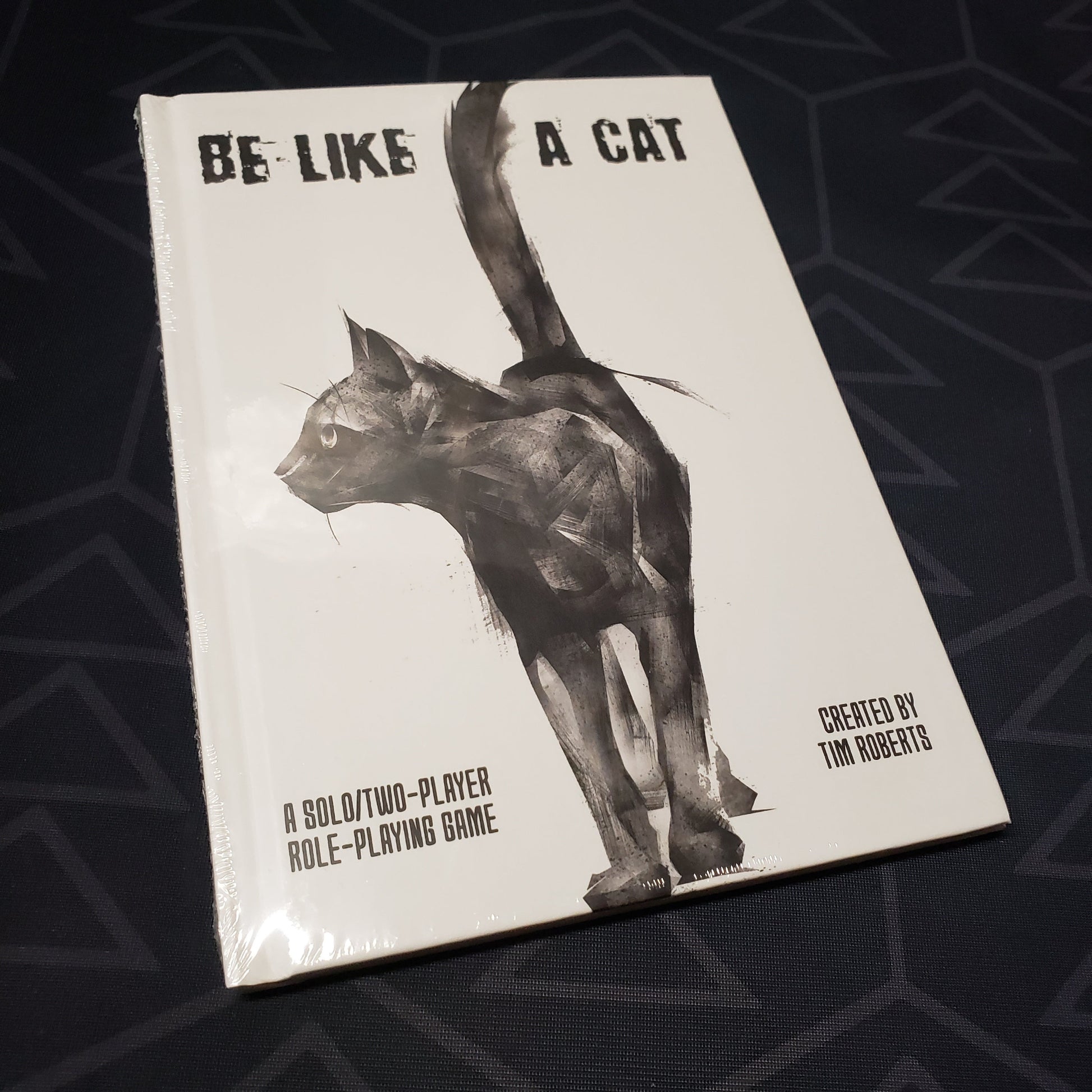 Image shows the front cover of the Be Like a Cat roleplaying game book