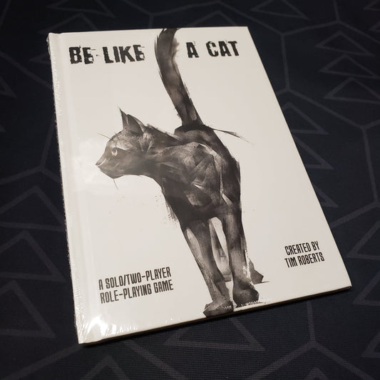 Image shows the front cover of the Be Like a Cat roleplaying game book