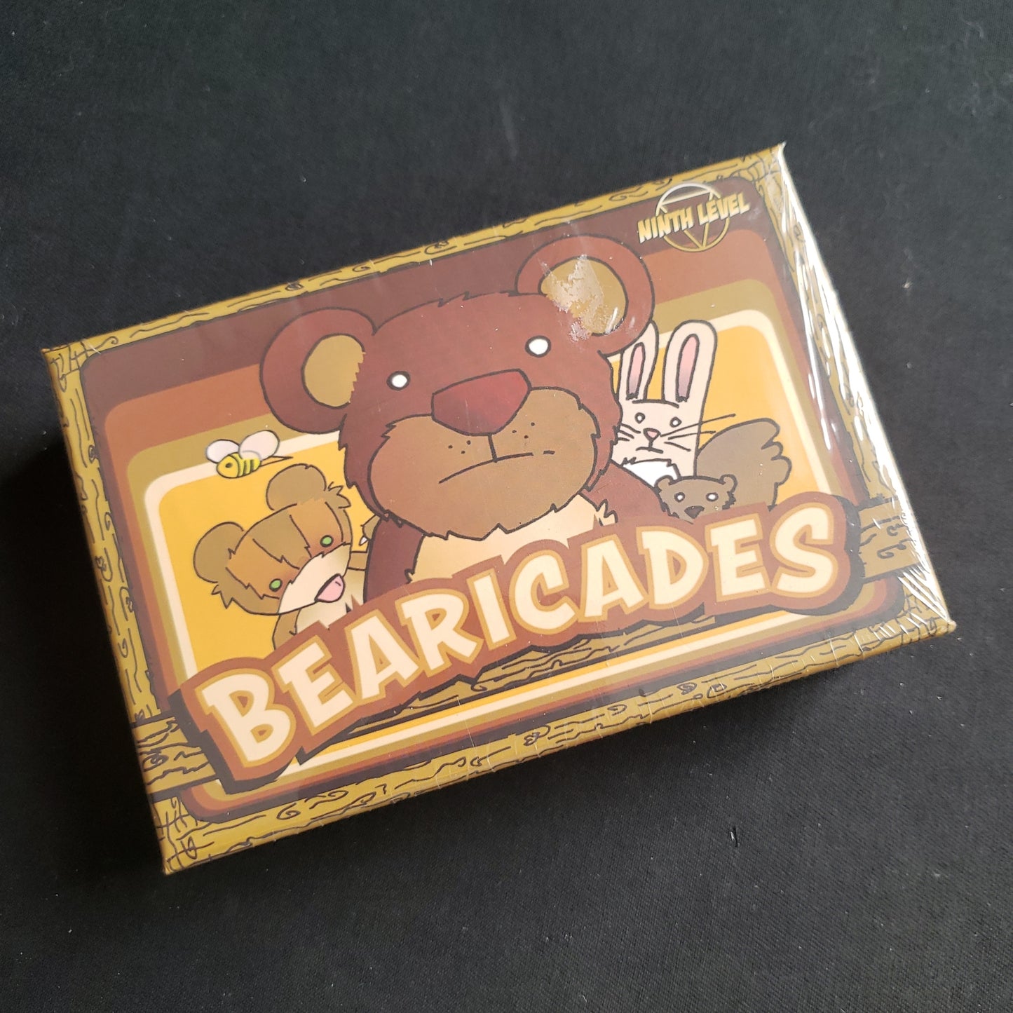 Image shows the front cover of the box of the Bearicades card game